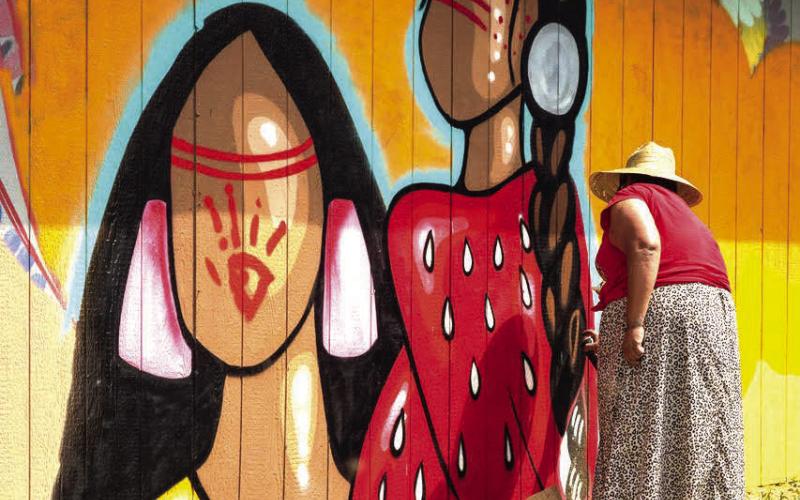 The 10th annual RedCan Invitational Graffiti Jam got underway Wednesday, July 10 in Eagle Butte. This year’s event features more than a dozen artists from across the nation and from as far away as New Zealand. Above, one of last year’s artists puts the finishing touches on her mural in Eagle Butte.
