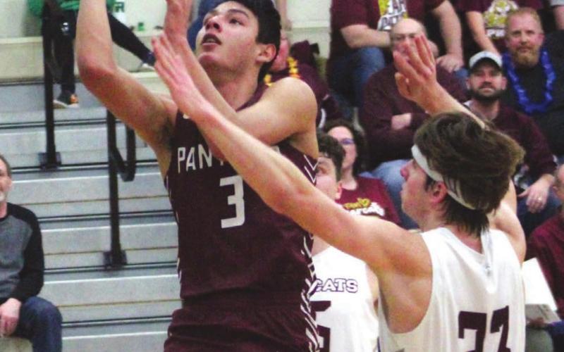 Timber Lake senior Chazz Gabe goes up for a shot against Freeman Academy/Marion’s Thalen Schroeder on March 8 at James Valley Christian. Photo by Ryan Deal/605 Sports