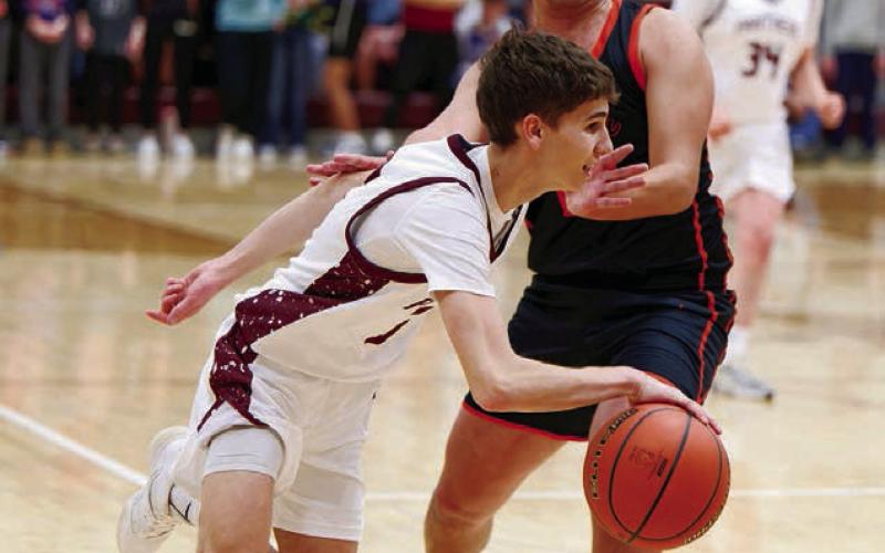 Timber Lake guard Braden Lawrence dribbles past a would-be Faith defender during the Panthers 59-43 conference win over the Longhorns last Thursday, Jan. 8 in Timber Lake. Lawrence finished the contest with eight points and a half-dozen assists. Topic photo by Marie DuPreez