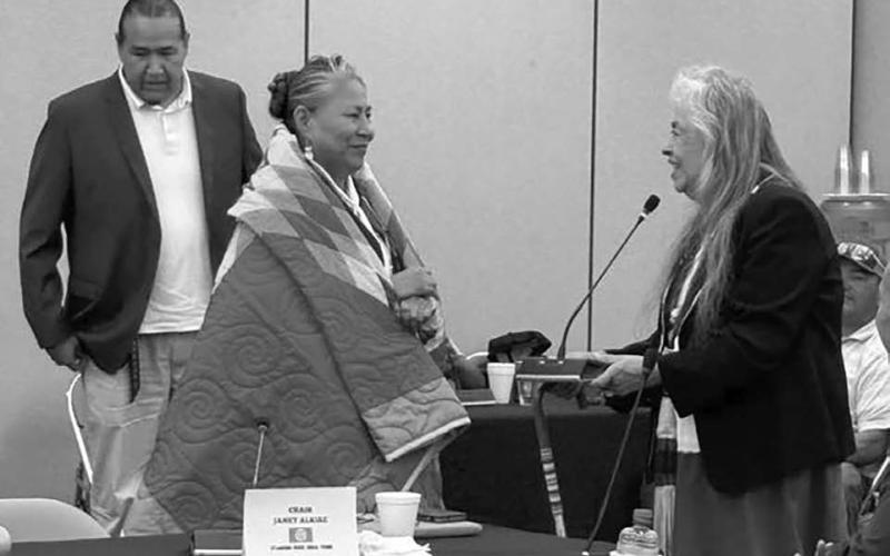 A. Gaye Kingman, (right) executive director of the Great Plains Tribal Chairmen’s Association (GPTCA), presented a star quilt to Janet Alkire, outgoing Chairwoman of the Standing Rock Sioux Tribe, during a GPTCA meeting last week. Looking on is Ryman LeBeau, Chairman of the Cheyenne River Sioux Tribe. Photo courtesy of Great Plains Tribal Chairmen’s Association