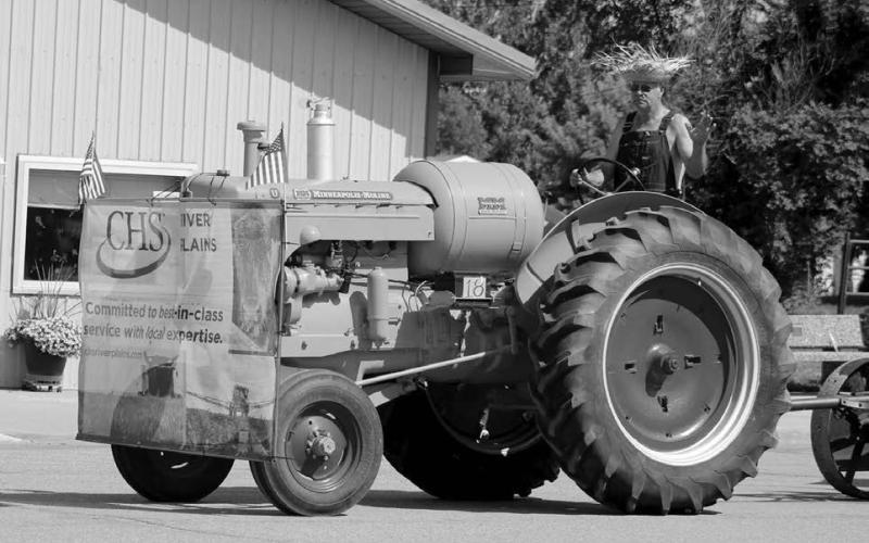 The Best Antique Entry Award at the Timber Lake Days of 1910 Parade went to Kimball and Donna Russell representing CHS River Plains in Isabel with a 1946 Minneapolis Moline tractor. Photo by Jon Flatland