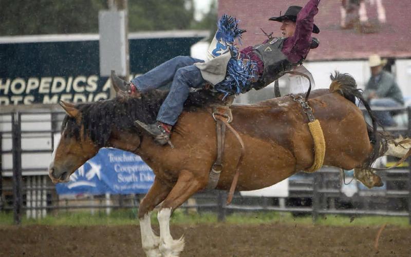 Cooper Schuelke of Faith earned a third place finish in saddle bronc riding at the SD High School Finals Rodeo in Ft. Pierre last week, advancing him to the National High School Finals Rodeo slated July 19-25 in Lincoln, NE. Photo by Chuck Miner