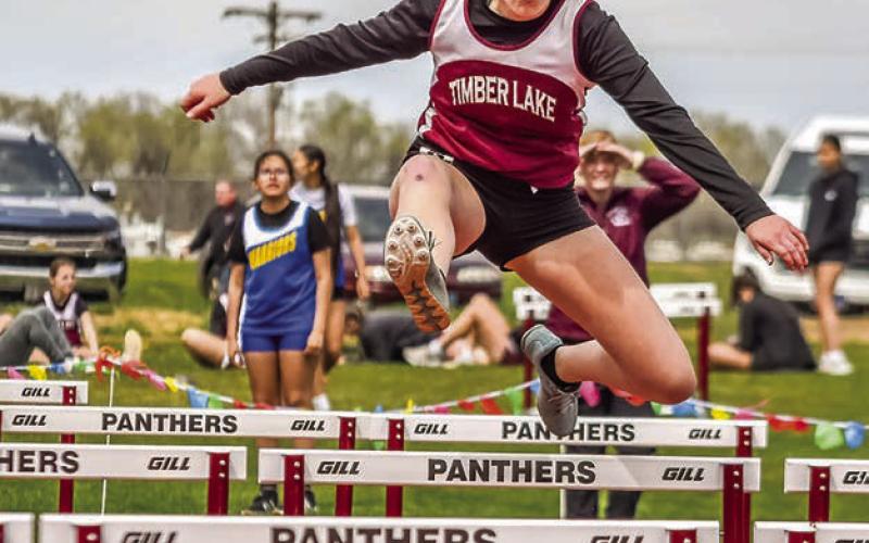 Eighth grader Evelyn Gill sales over a barrier in the 200 meter hurdles at the Timber Lake JV Track Invite last week. Gill took top honors in the event with a time of 37.32 seconds Photo by Marie DuPreez