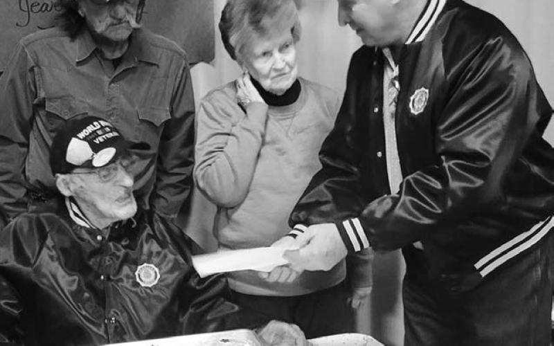 RIGHT: Isabel American Legion Post Commander John Dean Boldt (right) presented World War II veteran Herman Rosenau with a proclamation from Gov. Larry Rhoden. Also pictured are Herman’s wife Nina and their son Jim. Herman’s family hosted a 100th birthday party for him on February 15. His address is 21005 138th St., Meadow, SD 57644.