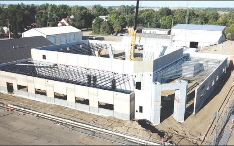 This drone photo taken last week provides an aerial view of the progress being made on the new Moreau-Grand Electric Cooperative headquarers on Main Street of Timber Lake. Visible in the center of the photo is the boom of a large crane that is used to put each prefabricated piece of the structure into place. Photo by Roger Lawien