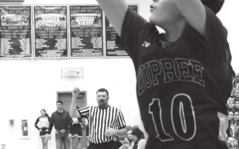 Dupree’s Elijah Brewer (10) releases a 3-point shot over Faith’s Caden Selby (5) during their Region 8B game last week. Photo by Patty Peacock