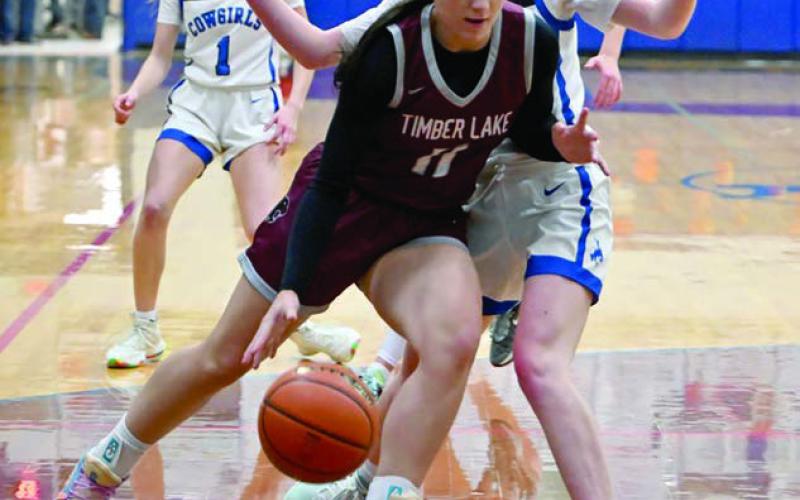 Sophomore guard Kiya Mowrer dribbles past a Lemmon Cowgirl defender during girls basketball action last Friday, Dec. 13. Lemmon upended the Lady Panthers 57-28. Topic photo by Marie DuPreez