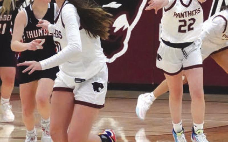 Above, Timber Lake center Kendyl Locken eyes the basket as she works toward two of her game-high 16 points during the Lady Panthers win over Ipswich on Saturday, Dec. 30. Far left, Natalie Lawrence (3) looks for an inside passing lane while playing the wing. Left, freshman Ruby Maher (22) fires an outlet pass to classmate Jaylee Schoelerman to start a Lady Panther fast break against North Central on Thursday, Dec. 28. Photos by Marie DuPreez