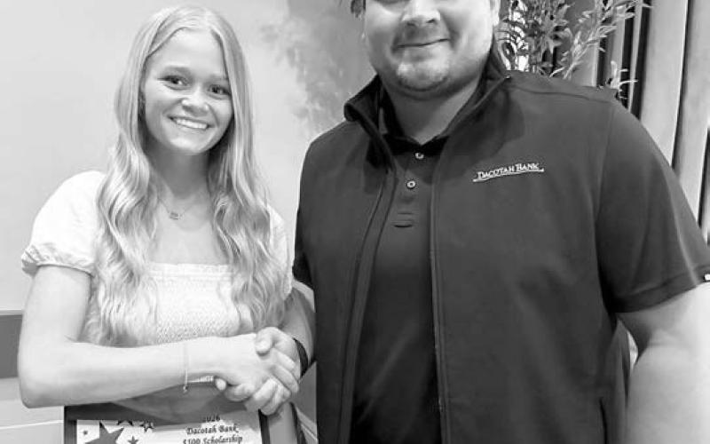 For over 30 years, Dacotah Bank has offered scholarships to high school seniors whose families are customers of Dacotah Bank and Dacotah Insurance. Over $70,000 in scholarships were awarded this year throughout South Dakota, North Dakota, and Minnesota. Timber Lake senior Hailey Roggow (left) was presented with a $2,000 scholarship by Senior Ag Banker Fred Vogel (right) from the Dacotah Bank in Mobridge.