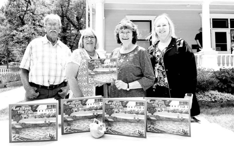 The “Let’s Feed the Fish - Meet Me at the D.C. Booth Historic National Fish Hatchery” book was published by the Booth Society, the nonprofit friends group of the hatchery. Pictured L-R are Illustrator Bill Feterl and authors Karen Holzer, Joanna Jones and Kindra Gordon.