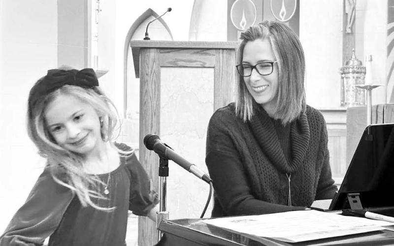 Rowan Maher and her vocal teacher, Colette Schaffer, were all smiles after Rowan sang “Silent Night” for a full-house audience at the Community Winter Celebration at Holy Cross Church on Sunday, December 1. Performers from Holy Cross, United Parish and New Hope shared their talents.