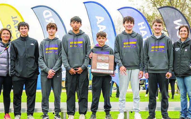 The Dupree Tigers finished third in the State Class B Boys Cross Country race held Saturday in Huron. Team members include (l-r) Coach Jessie Longbrake, Joseph Brewer - alternate, Walker Farlee, Jaden Scott, Rowdy Schrempp, TayShaun Cudmore, Spencer Olsen and Assistant Coach Jazmyn Holmes. Photo courtesy of Kathy Olsen