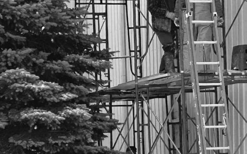 Rusty Simon and his crew braved snow and cold temperatures last week to make repairs to the outer tin on a portion of the Isabel Community Center.