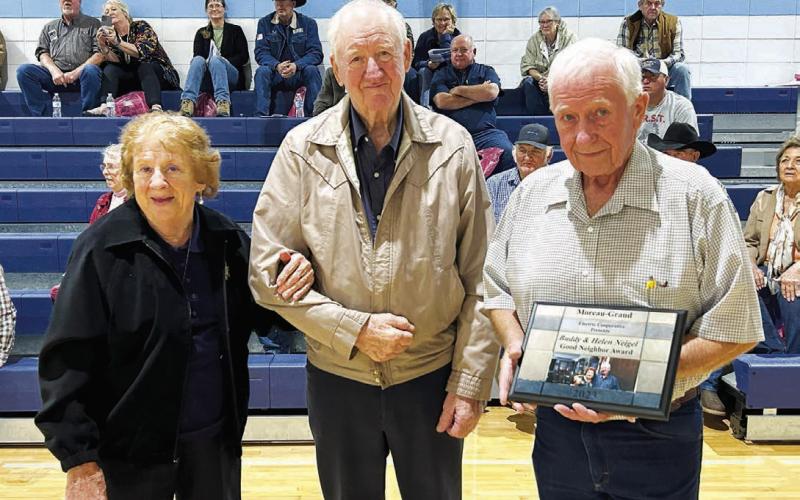 ABOVE: Helen and Buddy Neigel of Eagle Butte were presented with the Good Neighbor Award by outgoing board president, Larry Hieb. RIGHT: Geralyn Hahne of Trail City was elected to replace the late Kelly Landis on the Moreau-Grand board. She was also elected secretary in the board’s reorganizational meeting. FAR RIGHT: Kerry McLellan of Lantry was reelected to a three-year term on the board and was chosen to continue as vice-president.