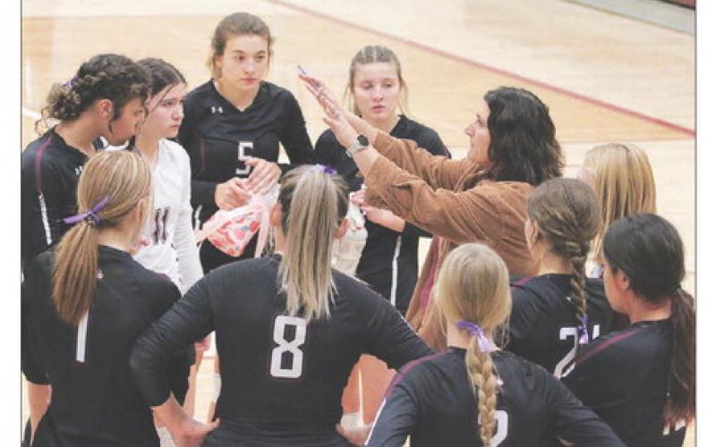 Timber Lake Lady Panther Head Coach Megan Bickel goes over strategy with her team between games of a match with the Newell Irrigators last Friday, Oct. 21. Timber Lake and Newell went into the game sitting one-and-two atop the Region 8B standings with the Lady Panthers winning a 3-game sweep to avenge a loss to the Irrigators in the championship match of the Little Moreau Conference Tournament in September. Photo by Jon Flatland
