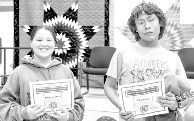 Top attendance awards of shirts and certificates in the junior high and high school went to (left) Morgan Jeffries with 1 day absent and (right) Eli LaPointe who missed less than a half of a day.