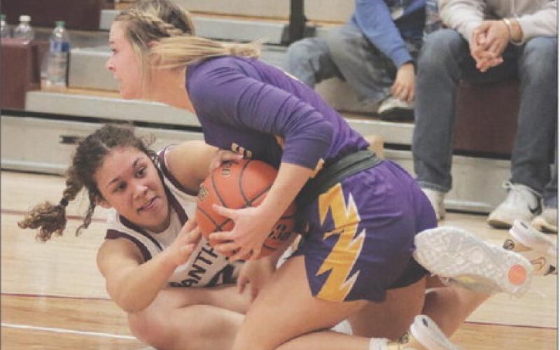 Timber Lake sophomore forward Jasmine Nash (left) and Dupree senior guard RaeLynn Vines battle on the floor for possession of a loose ball during non-conference girls’ basketball action between the Lady Panthers and Lady Tigers last Tuesday, Jan. 31, in Timber Lake. Dupree held off a late rally to defeat Timber Lake 50-42, handing the Lady Panthers just their third loss of the season. For more game coverage, turn to Page 5B. Photo by Jon Flatland