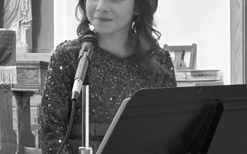 Kiernan Biegler smiles at her teacher, Colette Schaffer, after her solo.