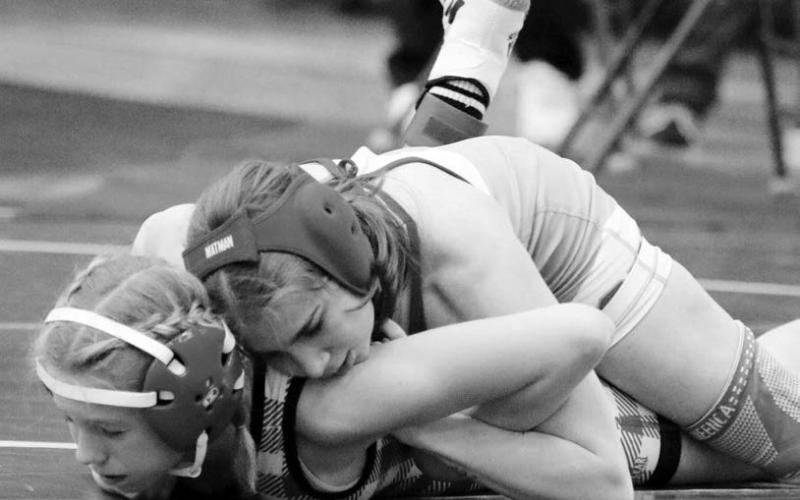 Cheyennne-Eagle Butte-Dupree wrestler Eulayla Maynard rides Zoey Donovan of Chamberlain during the Big Dakota Conference Tournament in Ft. Pierre on Saturday, Feb. 4. Maynard, 15-6 on the season, finished second overall in the Girls’ 106-pound division. Photo by Jon Flatland