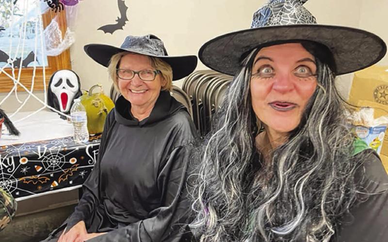 Scary witches Sheila Schweitzer (LEFT) and Carletta Aberle entertained kids at Trunk or Treat at the St. Joseph Center.