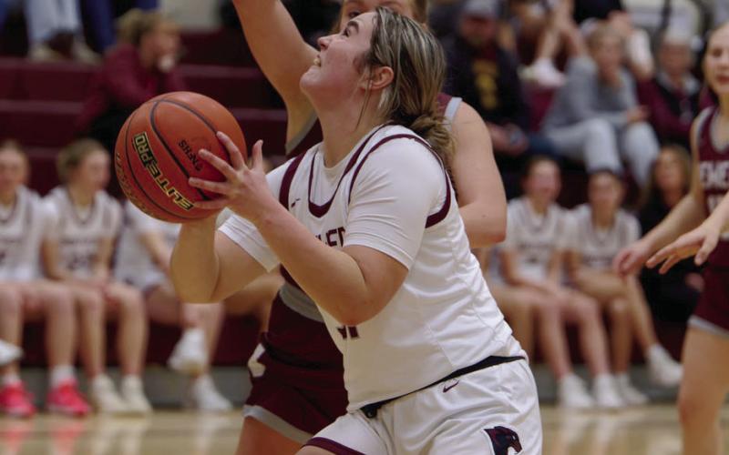 Kate Biegler prepares to put up a shot during a Timber Lake girls basketball game from Newell during the 2025-26 season. Photo by Marie DuPreez