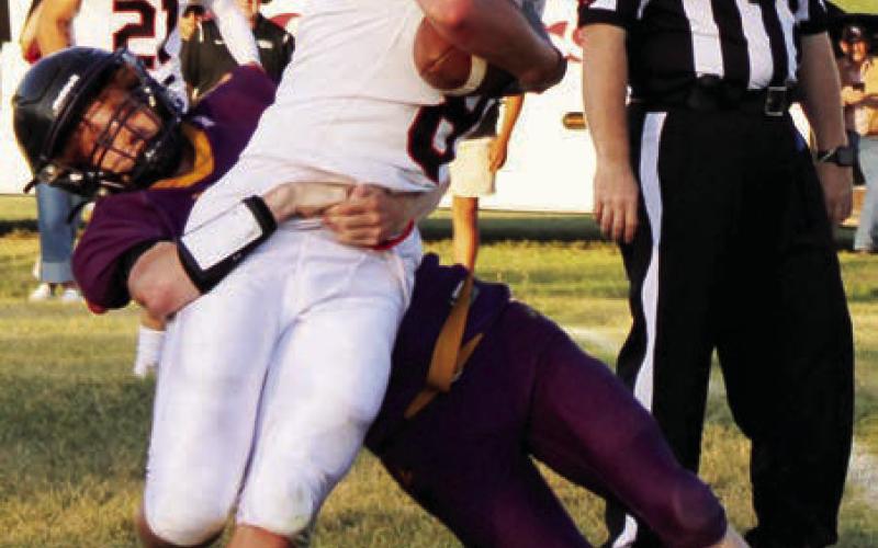 Dupree senior Fletcher Birkeland tackles a Lyman runner during the Tigers football seaaon opener. Dupree knocked off North Central last Friday, Aug. 29, and faces unbeaten Hill City this Friday, Sept. 5, in Hill City. The Rangers are 2-0 after lopsided wins over Stanley County and Lemmon-McIntosh.  Photo by Patty Peacock