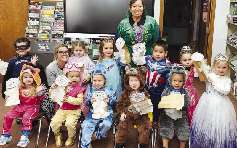 Timber Lake Head Start kids enjoyed a visit to the Dewey County Library on October 30 where they listened to a story and made a craft. Front (l-r) are Mia Linderman, Reagan Kraft, Kara Aberle, Dexter Aberle, Tomi White; middle: Antonio Loaiza-Montiel, Kacey Long, Haysley Long, Shiloh Smith, Khalil Thompson, Leyla Bullhead, Nora Serr; back: teacher Nina Schumacher.