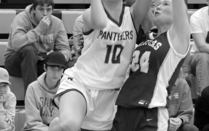 Freshman guard Jaylee Schoelerman draws a foul from Strasburg-Zeeland defender Jordyn Heidrich during action at the Mobridge Rotary Classic on Saturday, Dec. 16. Timber Lake downed the Clippers to improve to 2-3 on the season. Photo by Jon Flatland