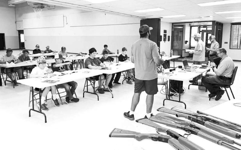 Eighteen students age 11 and older took the HuntSafe class offered by the South Dakota Department of Game, Fish and Parks at Timber Lake on July 10. Completion of the course made them eligible for a youth hunting license at age 12. Above, Jakways Mendoza, a Timber Lake teacher, was one of the instructors, along with Kyle Nilson of Timber Lake and GF&amp;amp;P personnel. Photo by Kathy Nelson