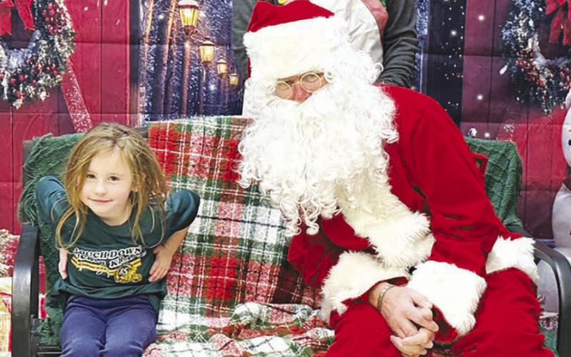 Scarlette Shepard, daughter of Ann D’ Hager, came to see Santa but didn’t want to get too close.