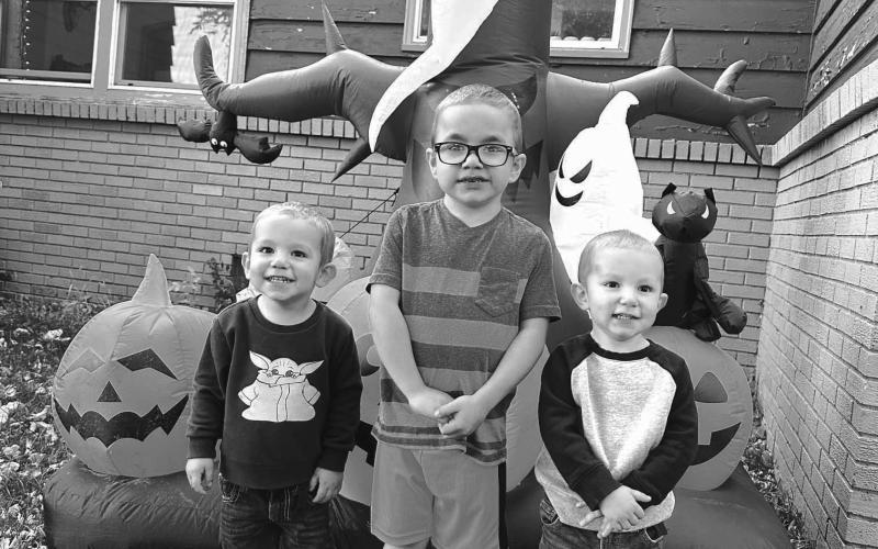 Ryker Bridges and his twin brothers, Rhett (LEFT) and Rowan, are ready for Halloween. Mom and Dad, Pelagie and Wesley, helped them with the blow-up decorations but no one is saying what costumes they will be wearing for the Halloween parties and trick-or-treating.