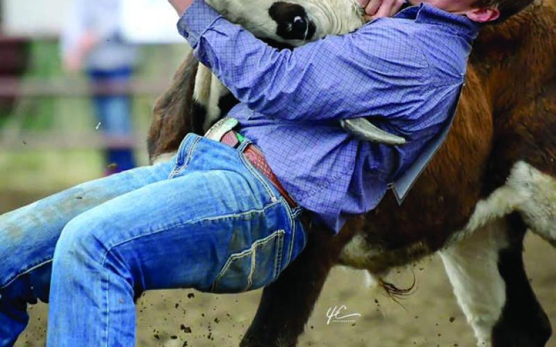 Braydon Terveen-Smith of Lantry takes down a steer during the Dewey County 4-H Rodeo on Sunday, May 25 in Timber Lake. He won the senior boys steer wrestling, senior boys saddle bronc riding, and teamed with Rylee Price of Faith to win the team roping event. All of that earned Terveen-Smith the senior boys All-Around honors. Photo courtesy of Chuck Miner