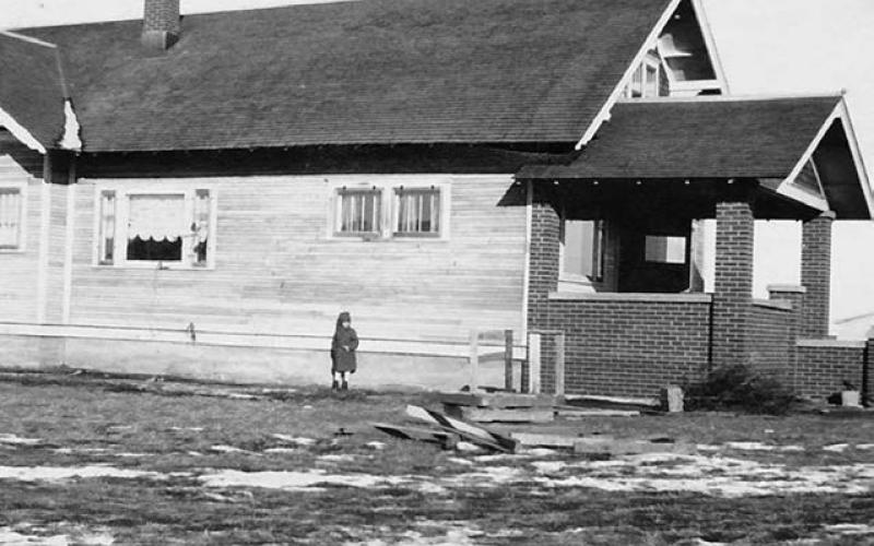 Young Elizabeth Sudmeier in front of the house where she was raised, at 6th and E streets in Timber Lake. Cody and Mary Lawrence and family now live there. It was the Francis and Anna Reinbold home for many years.