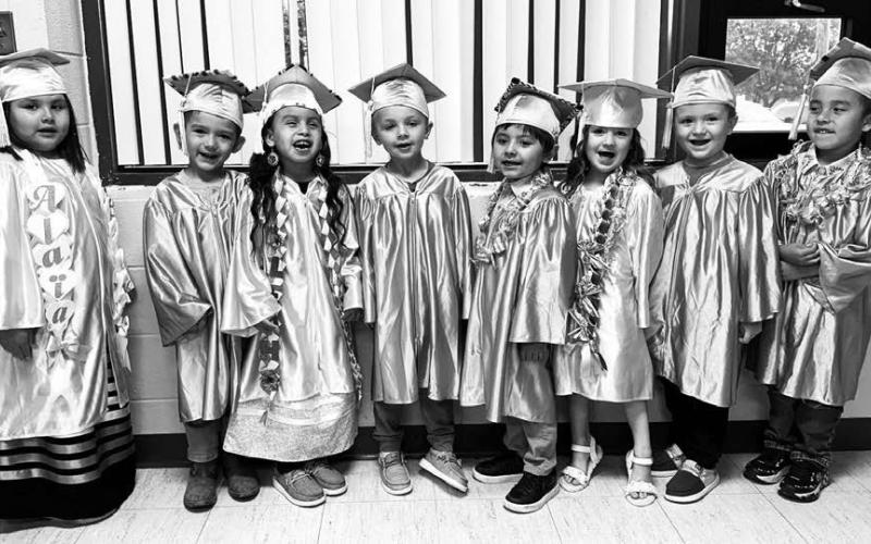 Eight youngsters graduated from Timber Lake Head Start on May 23. They performed songs for an audience at the Timber Lake Community Center and received diplomas, awards, and gifts. The graduates are (l-r): Alaia Edwards, Noah Marshall, Leah Mellette, Douglas Kraft, Riley Schumacher, Payton Bollinger, Slash Lawrence, and Kash Ward.