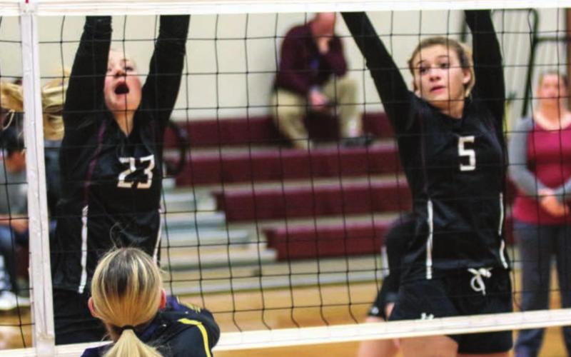 Panthers Stormi Hulm (23) and Shay Kraft (5) leap to defend the net against Herreid/Selby Area in recent volleyball action. Photos by Jon Flatland