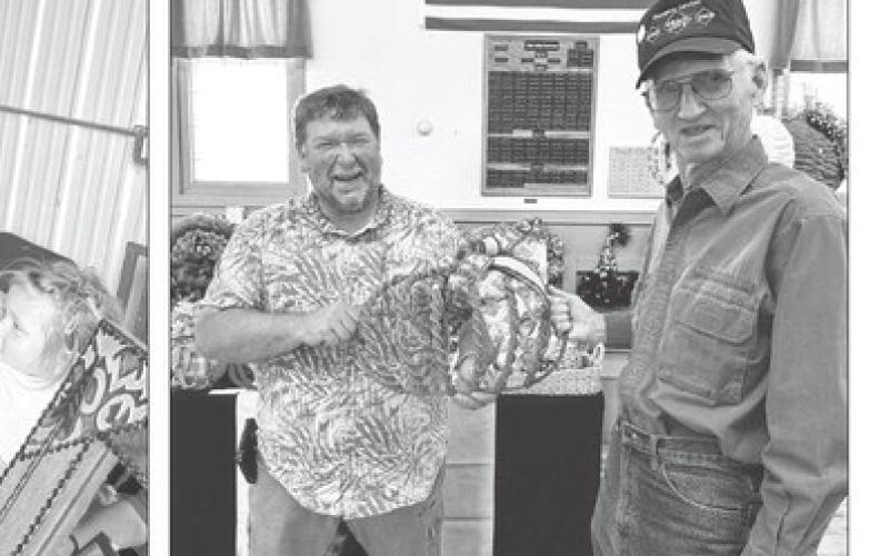 Bill Phillips and Bob Hollenbeck of Trail City show some of the creative crafts made by Karen Ziegler of Mobridge at the Trail City Fall Festival.