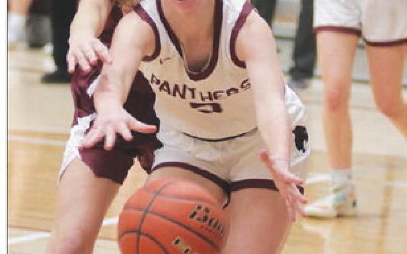 Junior Averie Marshall goes after a loose ball during Timber Lake’s win over McIntosh in the opening round of the 2023 LMC Tournament last Thursday, Jan. 19. The Lady Panthers were upset in the semifinal round by Lemmon and finished third in the tournament. Photo by Jon Flatland