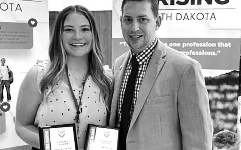 Kenna Webb, a senior at Timber Lake High School, was presented with two awards by Travis Lape, State Director of Educators Rising. She won in two categories of competition - STEM Lesson Plan and Children’s Literature. Photos courtesy of Luann Lindskov