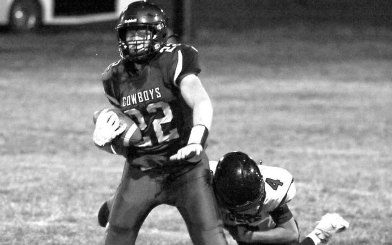 ABOVE: Lemmon/McIntosh’s Tell Mollman (22) is tackled by Dupree’s Treg Thorstenson (4) after Mollman made a catch and run.
