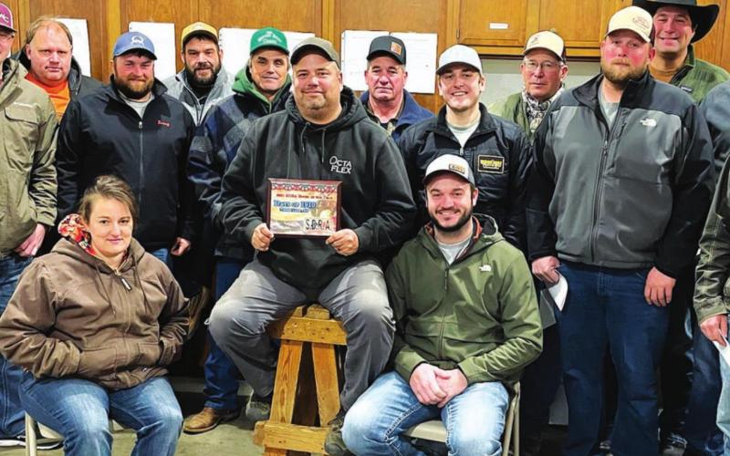Timber Lake Rodeo Association members at their Dec. 15 annual meeting. SEATED (L-R): Kari Goldade, Richard Gross holding the SDRA Rodeo of the Year plaque, and Brent Schweitzer; BACK: Derek Long, Larry Stapert, Terry Aberle, Ben Bieber, Archie Hulm, Chuck Maher, Shaun Maher, Doug Maher, Chris Aberle, Jace Booth, Bruce Schweitzer, Photo by Kathy Nelson Mark Leibel.
