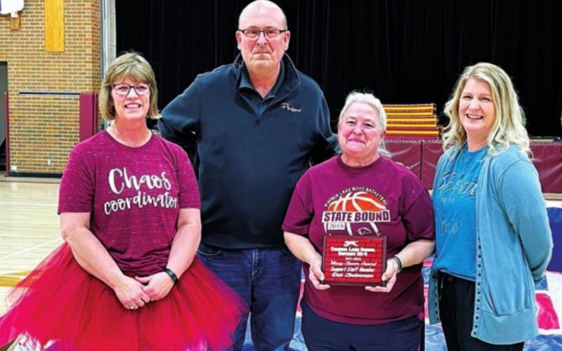 Custodian Deb Linderman (WITH PLAQUE) received one of three Support Staff of the Year Awards, named for the late Missy Stover, school custodian who passed away last year. Also pictured are (L-R) MS/HS Principal Julie Marshall, Supt. Dan Martin, and Elementary Principal Danae Paxton.