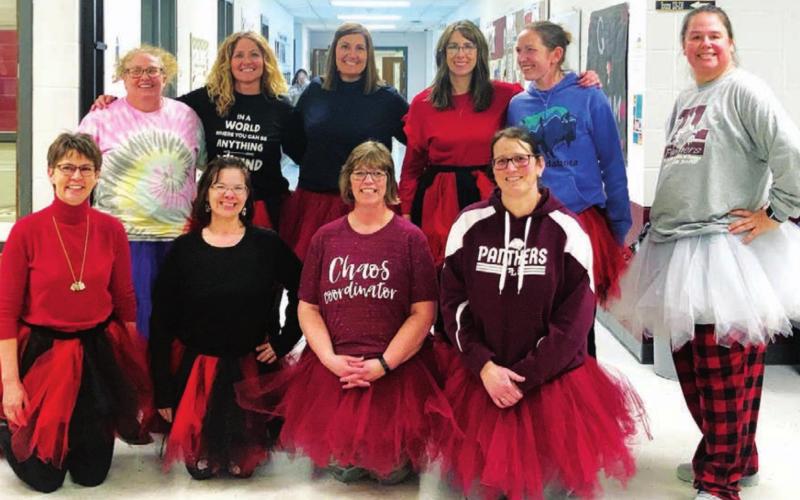 Teachers in tutus The staff at Timber Lake School had planned to celebrate 2-22-22 with tutus, ties, tie-dye and twins. Since they didn’t have school on Tuesday — due to weather — they combined tutus with cozy and comfy coffee wear the following day (which was the Wednesday Dress Up Day) for Coffee Bean Week. FRONT (L-R): Cara Biegler, Julie Barnica, Julie Marshall, Cindy Holzer; BACK: Dana Laubach, Karyl Boldt, Megan Bickel, Colette Schaffer, Alision Nilson, Jennifer Schoelerman.