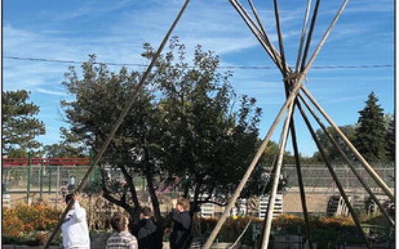 At the end of the day, high school boys learned how to take down the tipi, which groups of students had visited throughout the day. Photos by Kathy Nelson