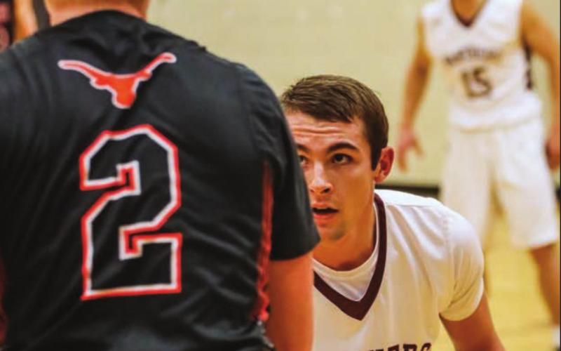 Brandt Ducheneaux is locked in on defense against Faith’s Jess Harper.