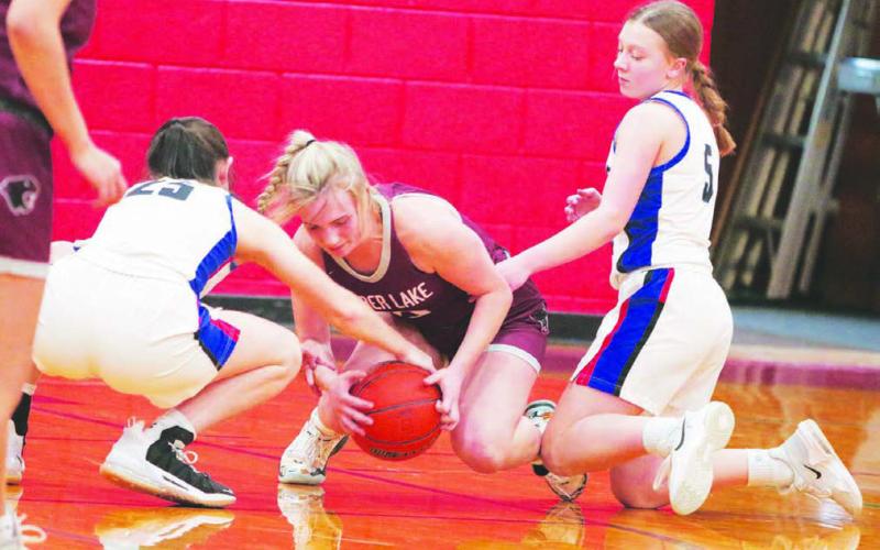 Timber Lake’s McKenzi Vomacka (center) battles North Central’s Natalie Bieber (25) and Alaina Dosch (5) for a loose ball during the Lady Panthers 59-35 win over the Thunder last Thursday, Dec. 29. Timber Lake hosts Potter County on Friday, Jan. 6, before traveling to McIntosh for a Little Moreau Conference tilt on Tuesday, Jan. 10. Photo by Jon Flatland