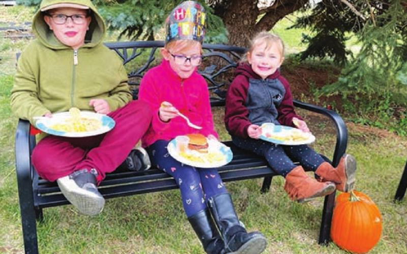 The Nilson kids (Garrett, Stella and Clara) enjoyed the Harvest Festival meal, which was also Stella’s birthday supper. Photos by Kathy Nelson