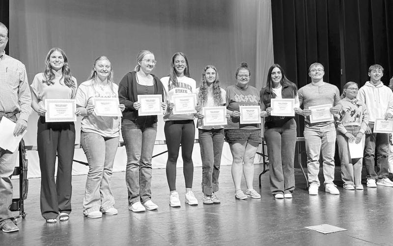 In the fourth year of its scholarship program, Western Dakota Bank awarded ten $1000 scholarships to local graduates. Rusty Gebhardt (left) and Karma Nash (right) presented the awards to (l-r) Meredith Maciejewski, Jordan Jones, Lola Hornick, Jasmine Nash, Natalie Lawrence, Molly Miller, Mckenzi Vomacka, Gabe Keller, Brelan Maher and Cole Ducheneaux.