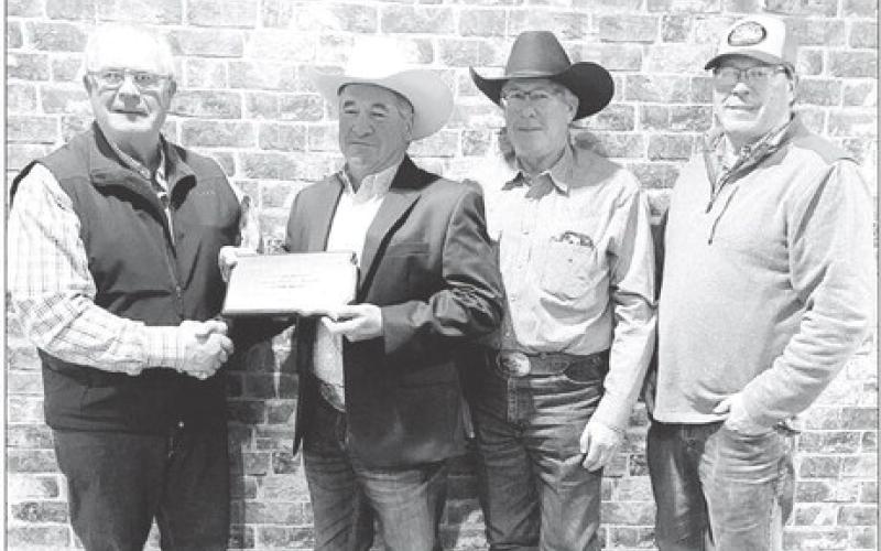 Chuck Maher of Timber Lake was named 2024 South Dakota Charolais Commercial Producer of the Year by the S.D. Charolais Breeders Association. He was presented with a plaque at the Association’s yearly banquet in Watertown on February 7. Pictured (l-r) are a representative of the S.D. Charolais Breeders Association, Chuck, and his brothers, Doug and Jim Maher, who surprised Chuck by attending the banquet.