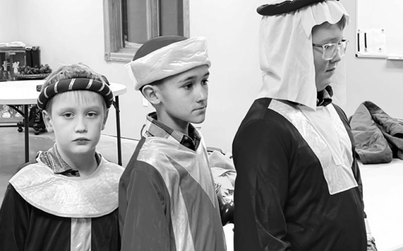 “Back stage” awaiting their cue are these three kings (L-R): Mason Hollenbeck, Emmett O’Leary, and Aiden Lindskov.