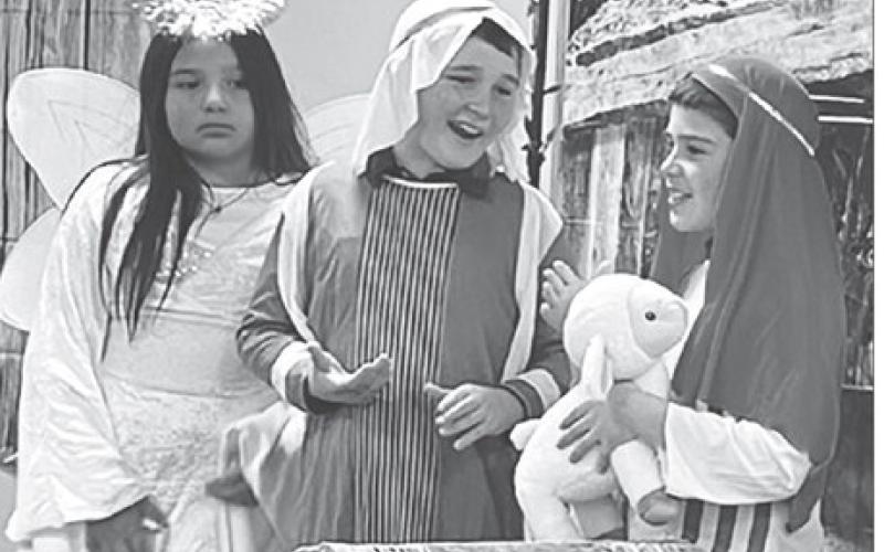 An angel (Marley Ward) and two shepherds (Luke Biegler and Glen Mowrer) were in the nativity scene at the Holy Cross K4J Christmas program Sunday afternoon. Sarah Schweitzer directed the program.
